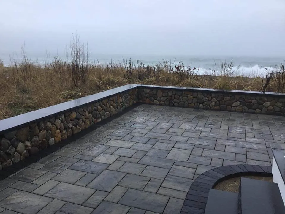 Completed stone patio with textured pavers